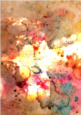 Detailed shot of a splatter effect pattern blending seamlessly from hot pink to sunny yellow.