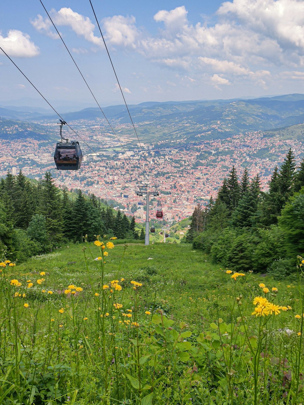 a gondola with a view of a city in the distance