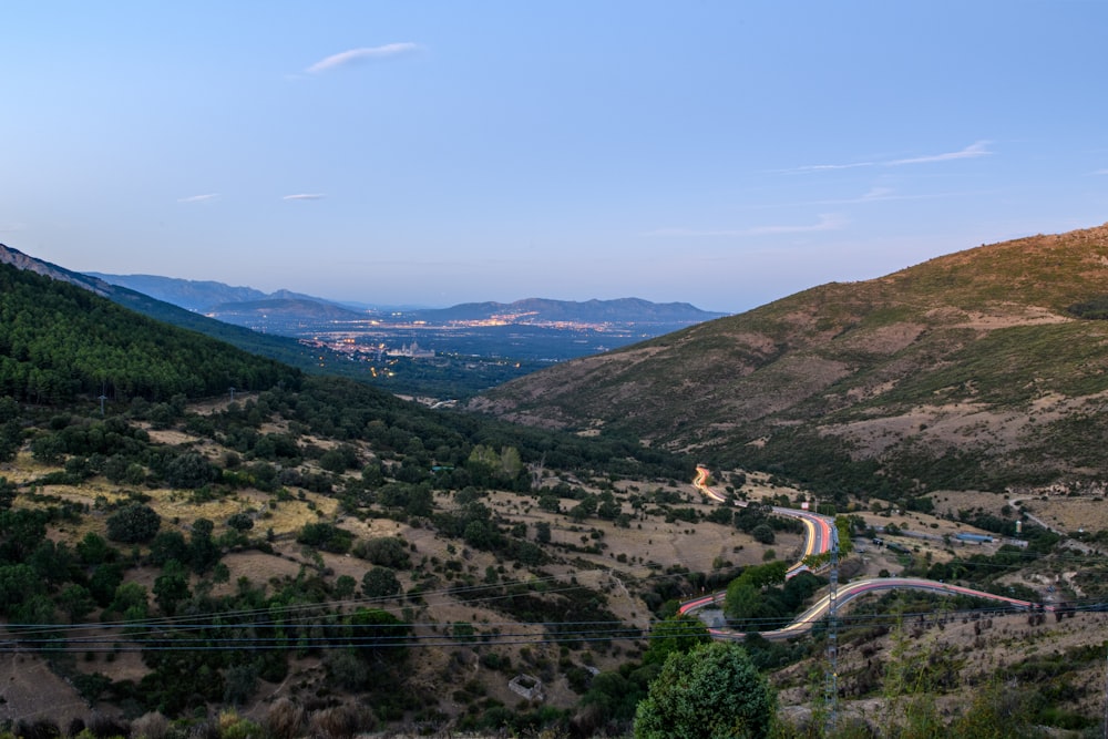 a view of a winding road in the mountains