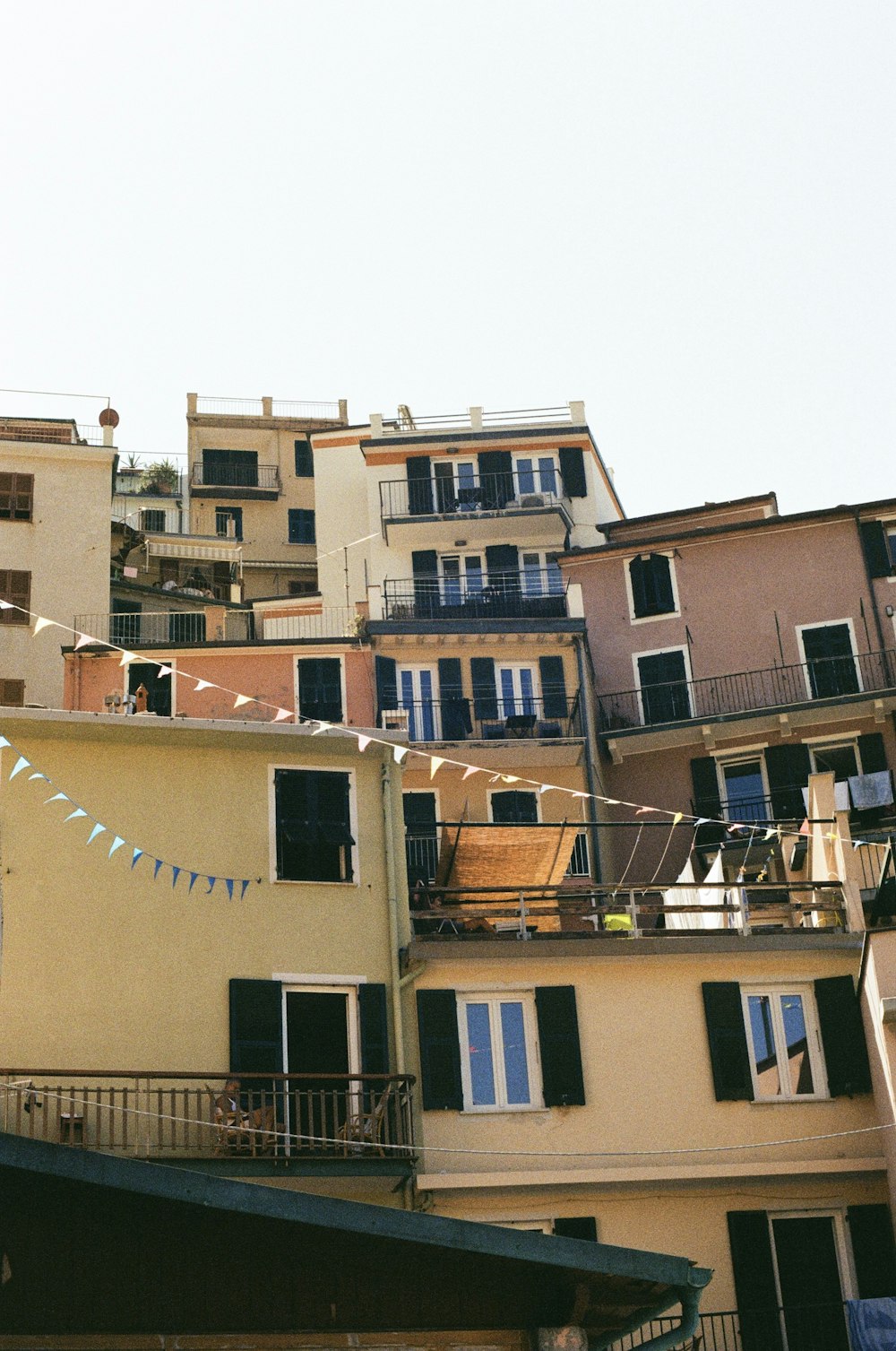 a group of buildings that have balconies on top of them