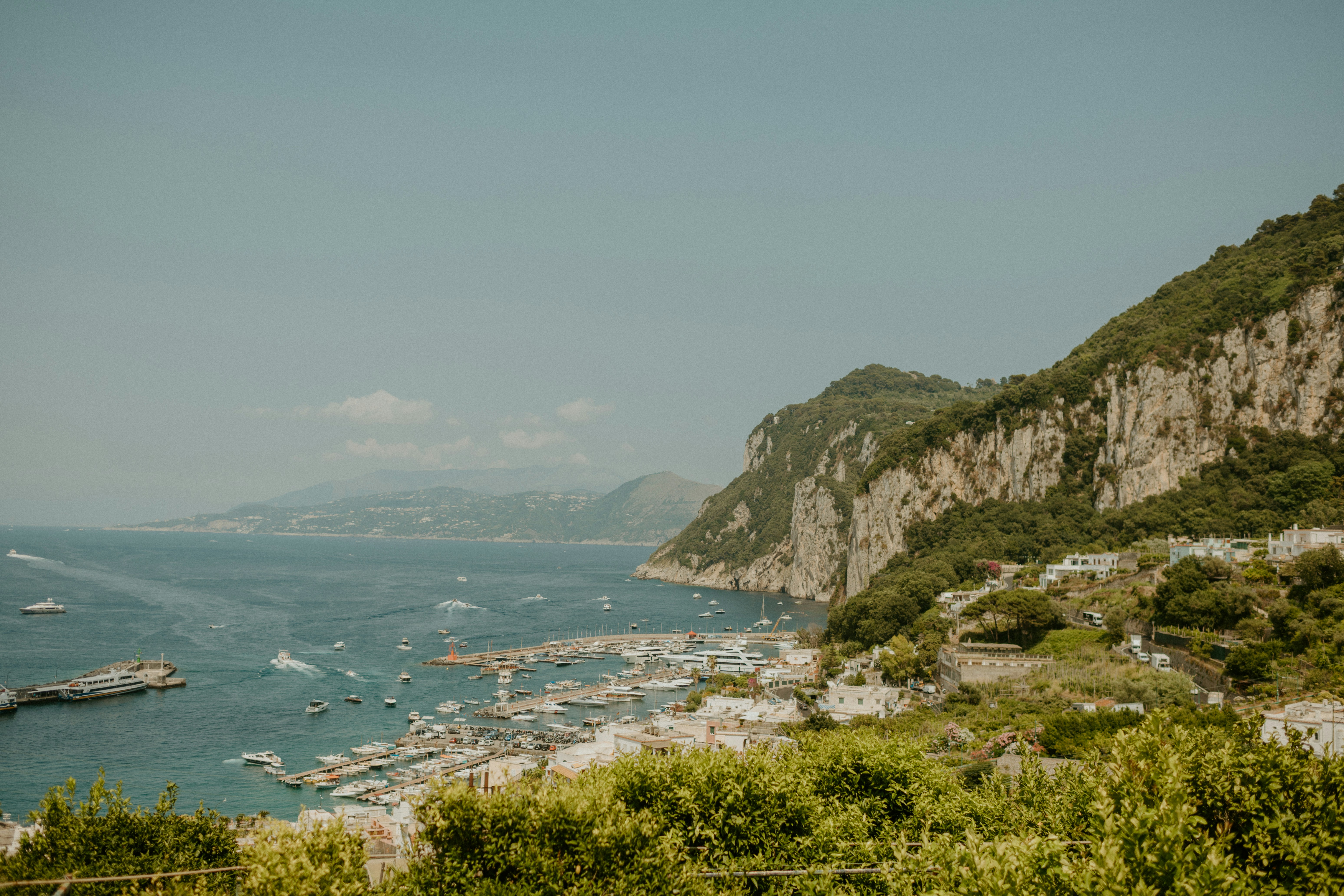 a body of water surrounded by mountains and trees