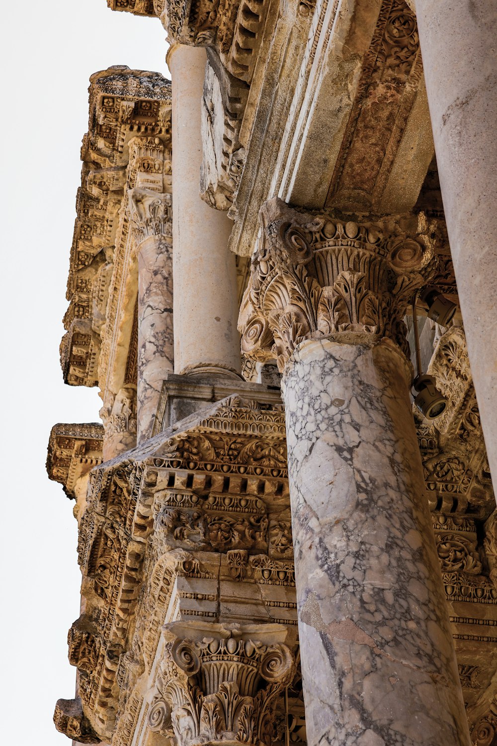 a close up of a column with a clock on it