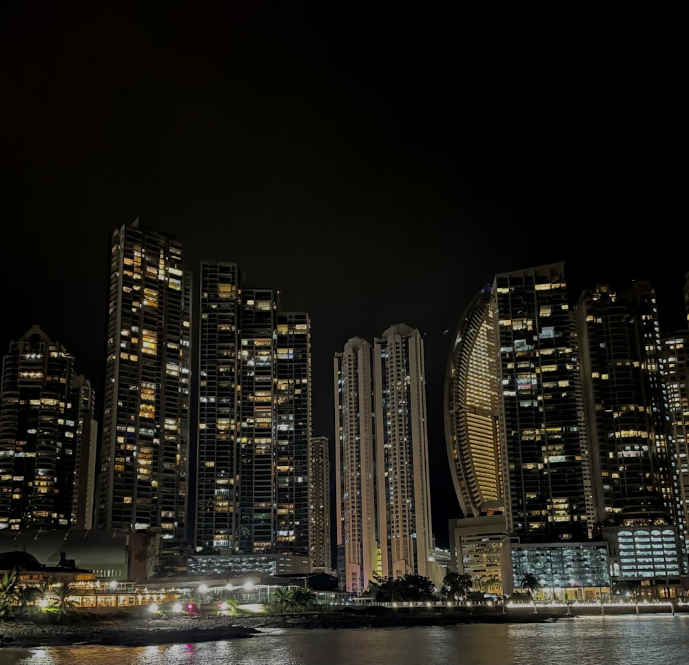 a city at night with a lot of tall buildings