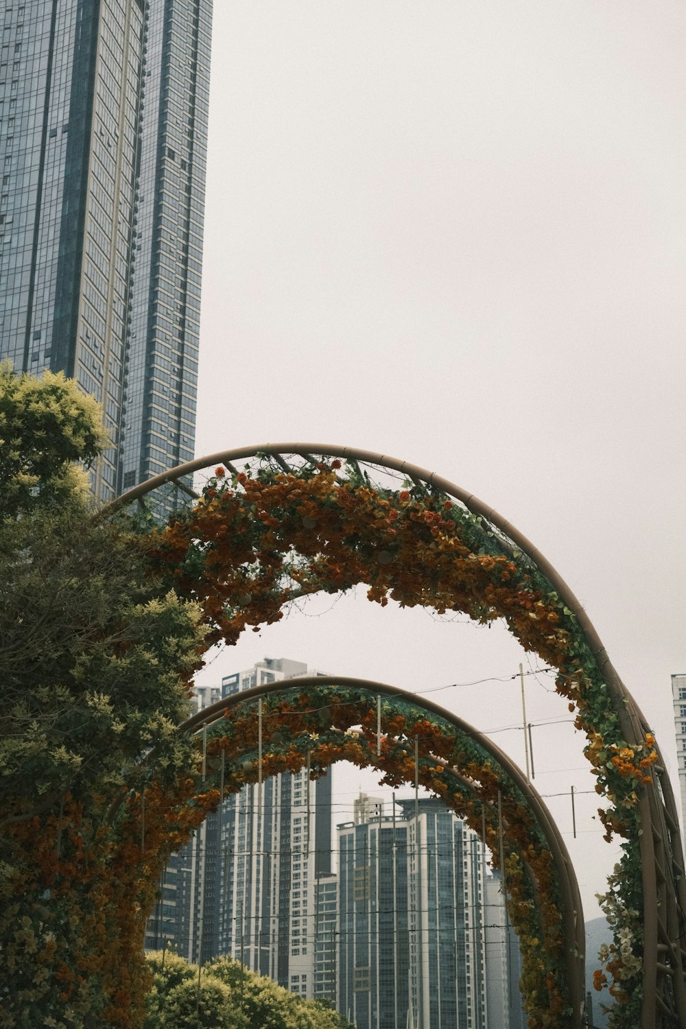 a couple of tall buildings sitting next to each other