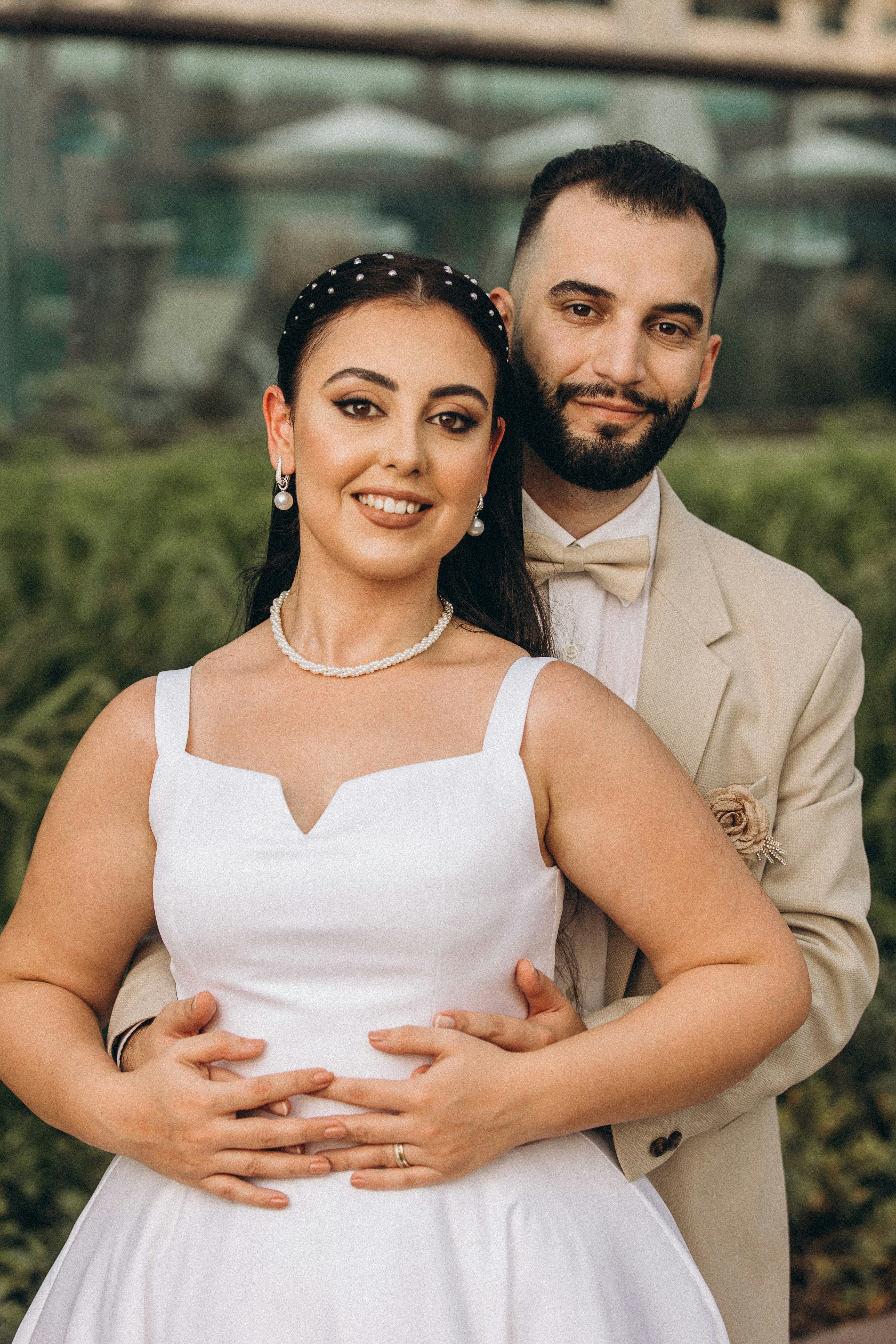 A bride and groom posing for a picture photo – Free People Image on ...