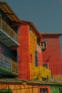 A vibrant collage of colorful Bolivian lodgings with lively outdoor scenes.