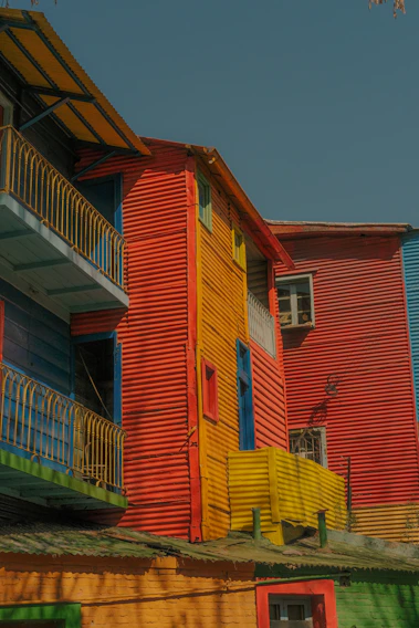 A vibrant collage of colorful Bolivian lodgings with lively outdoor scenes.