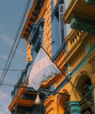 a building with a flag hanging from it's side