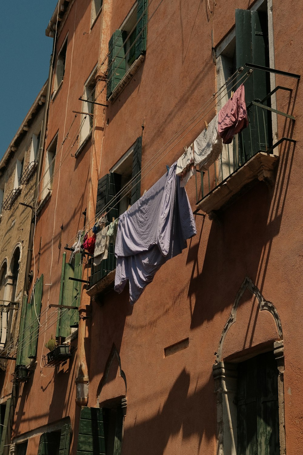clothes hanging out to dry outside of a building