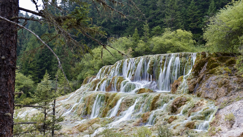 a waterfall with lots of water running down it