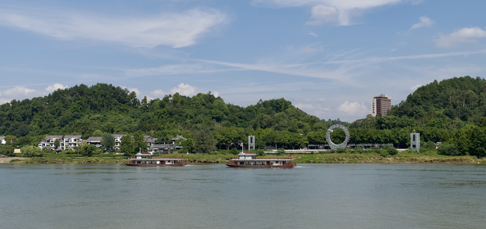 a body of water surrounded by trees and buildings