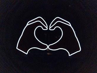 A sleek, modern illustration of two hands holding a glowing heart, symbolizing connection and trust.