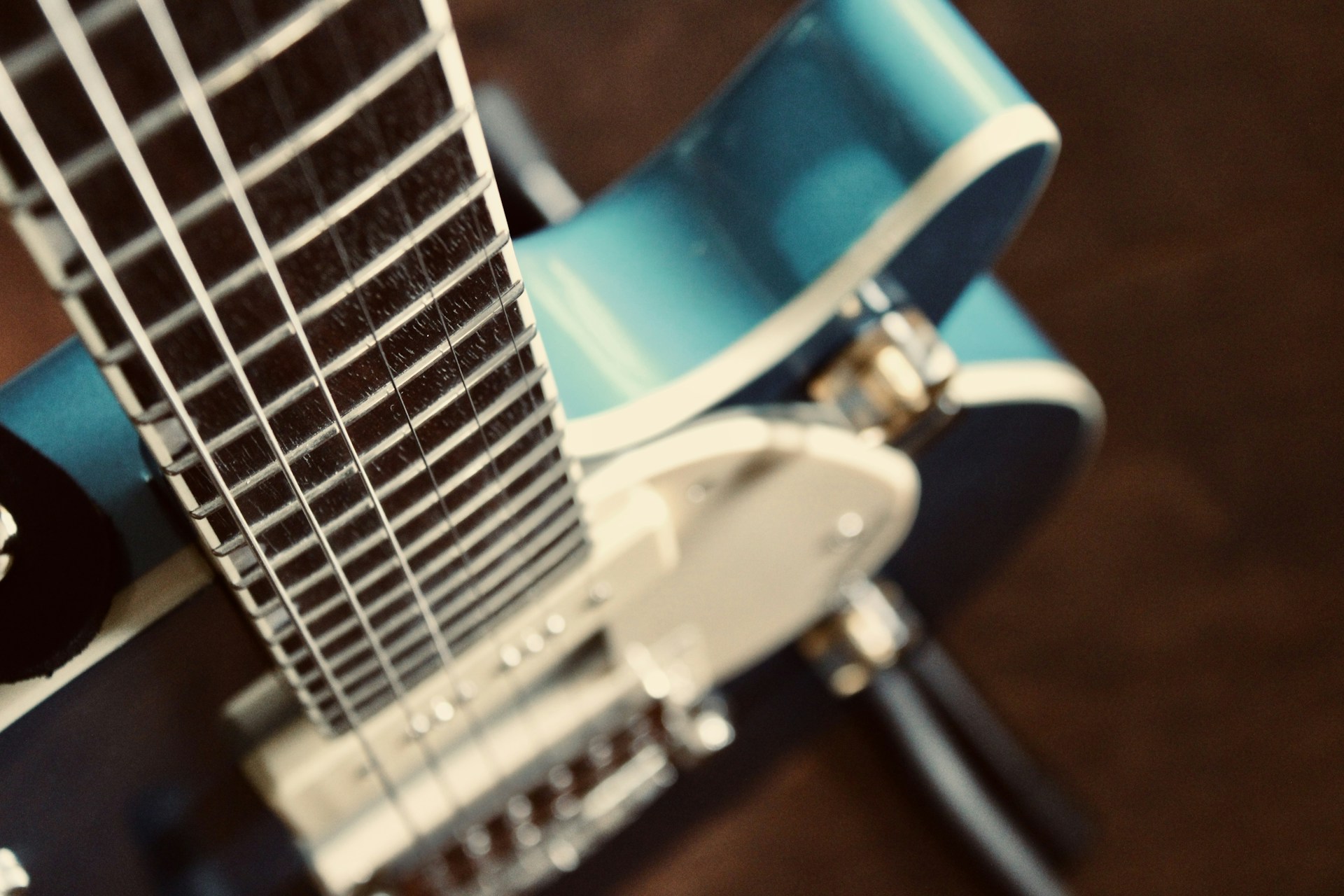 a close up of a blue and white guitar