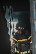 Close-up of a firefighter testing a smoke detector in the airport