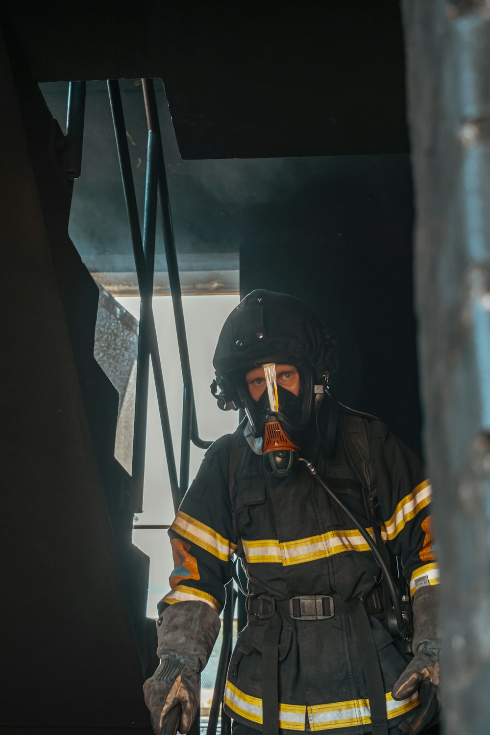 a firefighter with a breathing apparatus in his mouth