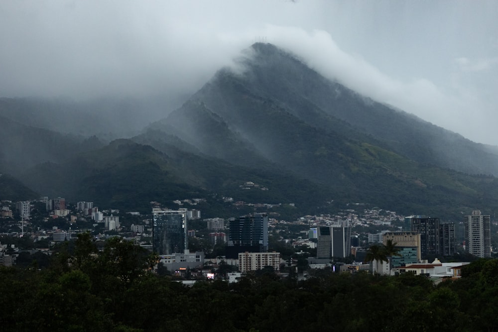 a view of a city with a mountain in the background