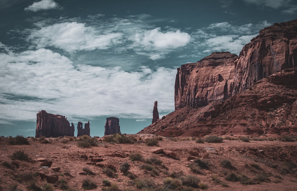 a large rock formation in the middle of a desert