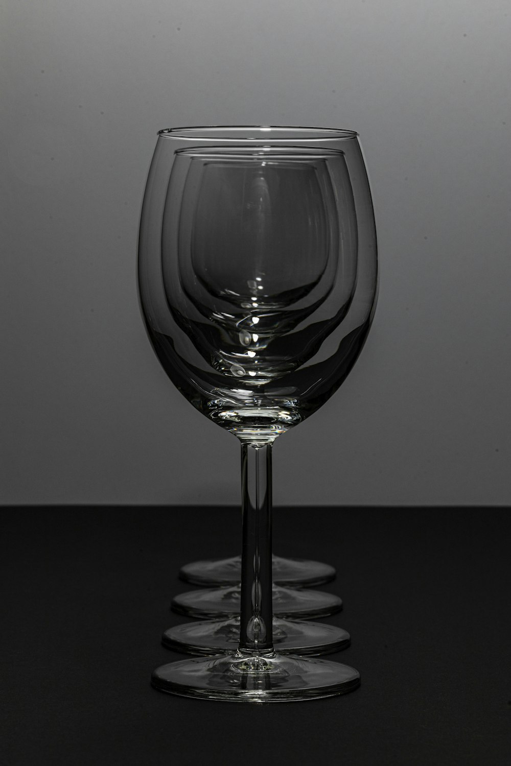 a wine glass sitting on top of a table