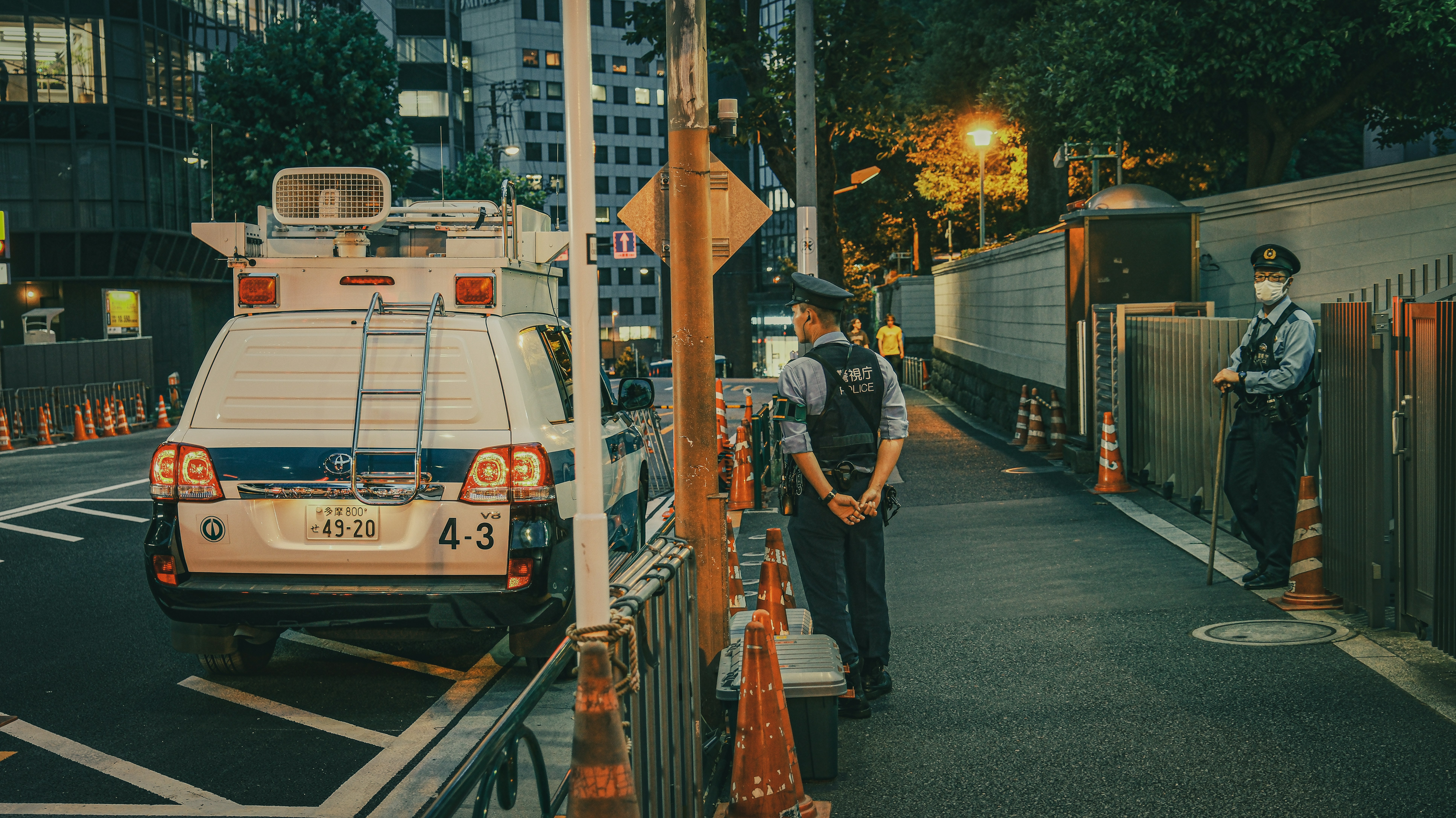 a police officer standing on the side of a road