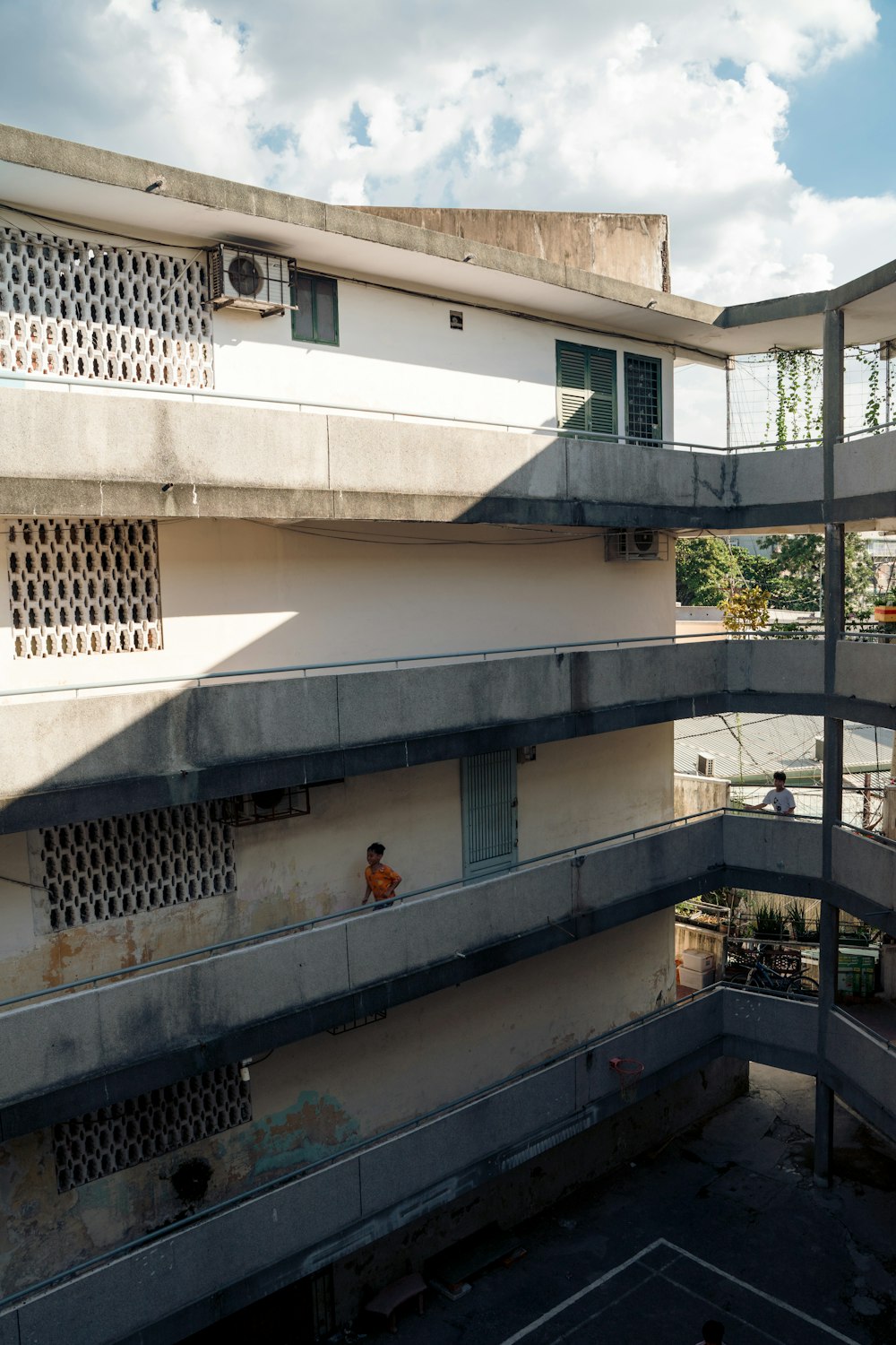 a tall building with a bunch of balconies on top of it