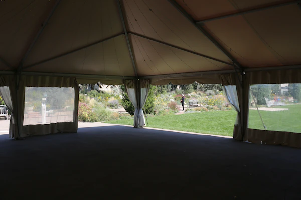 Open marquee structure with draped sides