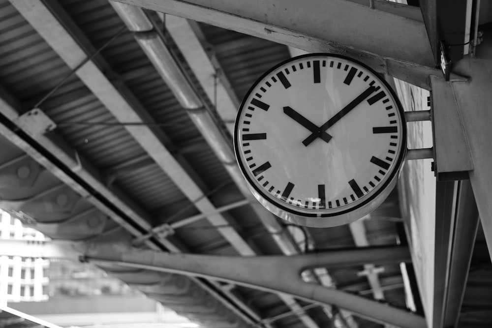 a clock hanging from the side of a building