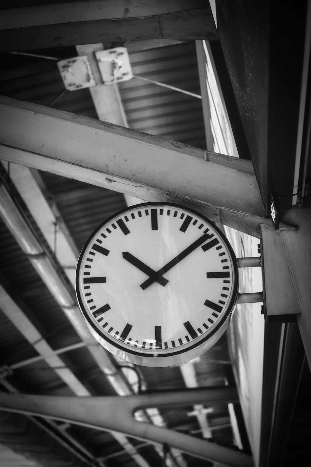 a clock hanging from the side of a building