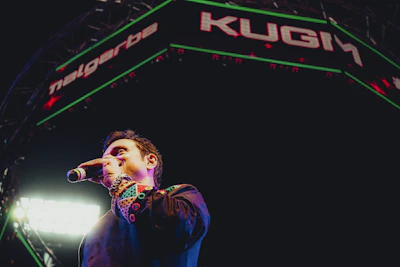 A confident child speaking on stage with a microphone, colorful lights shining.