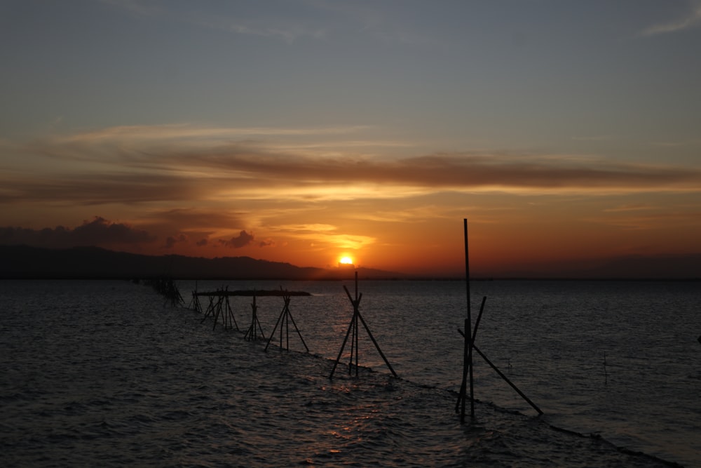 a sunset over a body of water