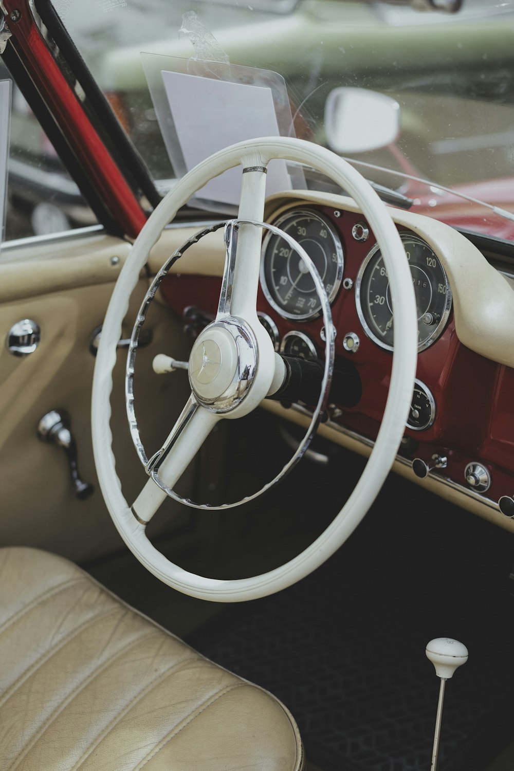 the interior of a car with a steering wheel and dashboard