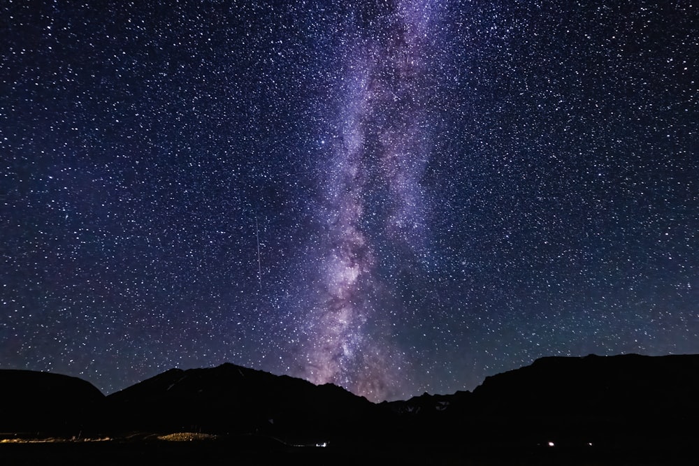 a view of the night sky with the milky in the background