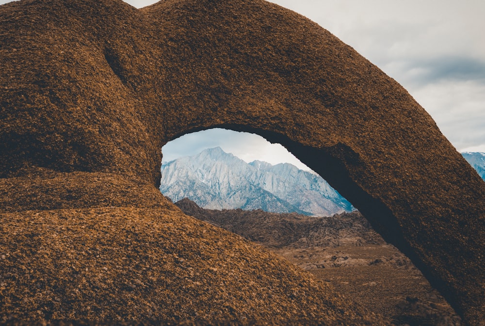 a rock formation with a hole in the middle of it