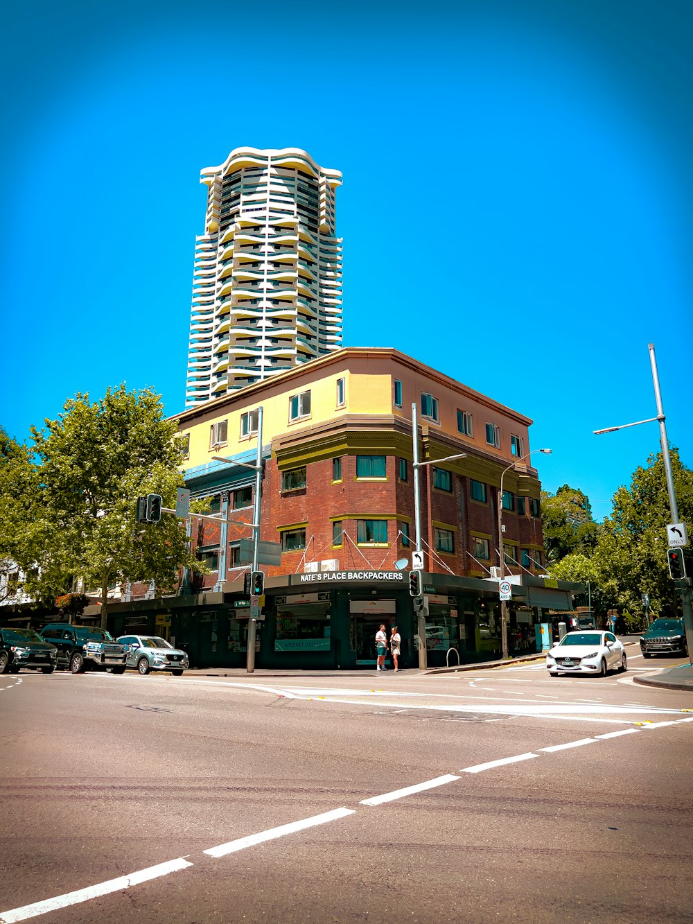 a tall building sitting on the side of a road