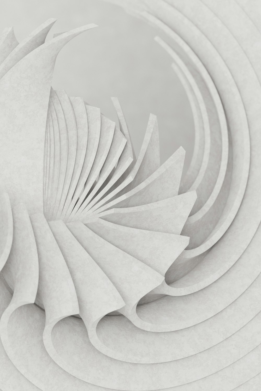 a white paper sculpture with a spiral design
