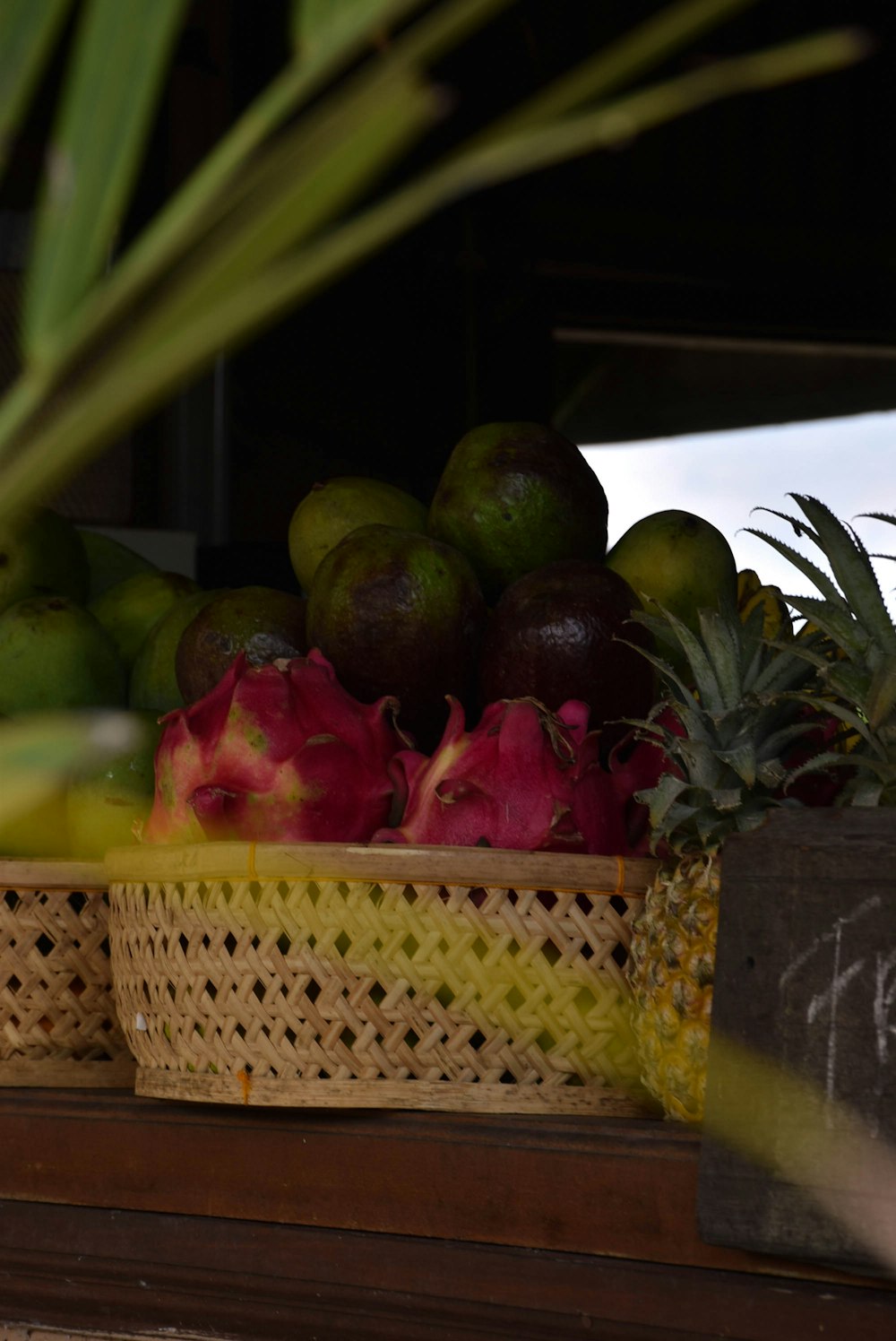 a close up of a basket of fruit on a shelf