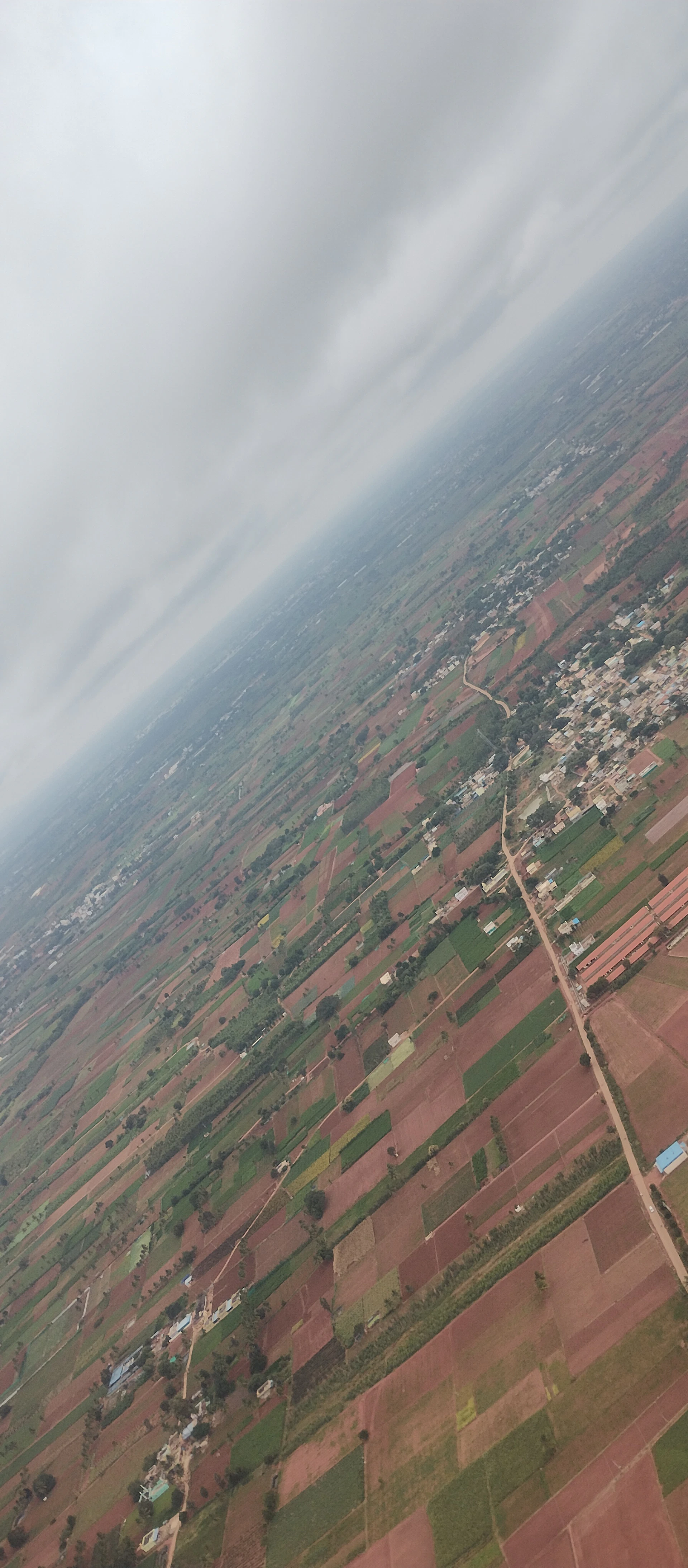 woman wearing yellow long-sleeved dress under white clouds and blue sky during daytime