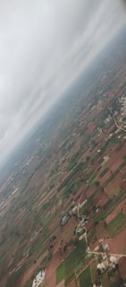 Aerial view of expansive agricultural land under cultivation.