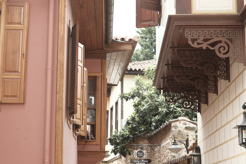 a narrow alley way with a clock on the wall