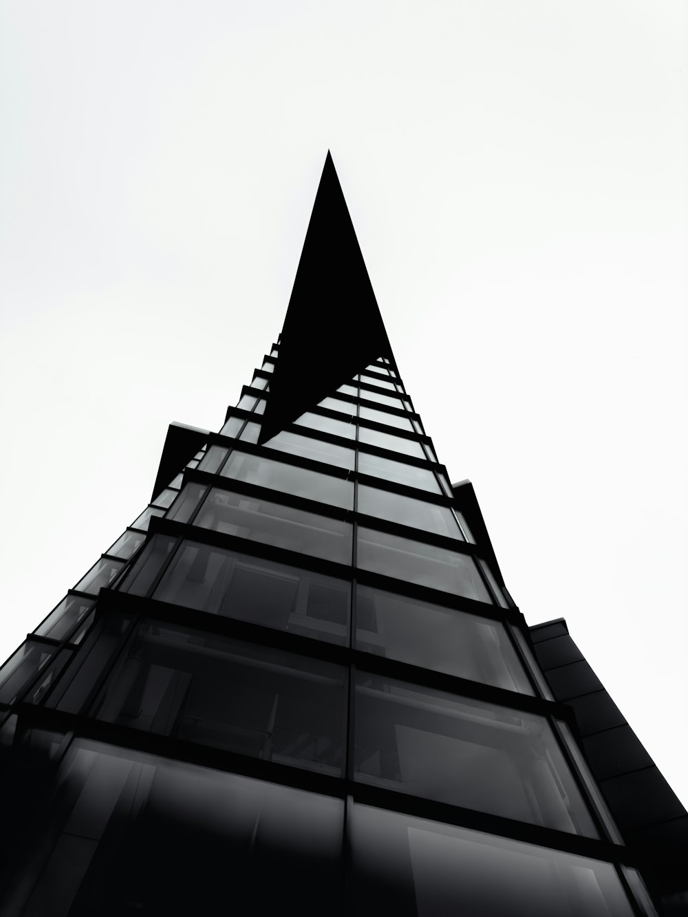 a black and white photo of a tall building