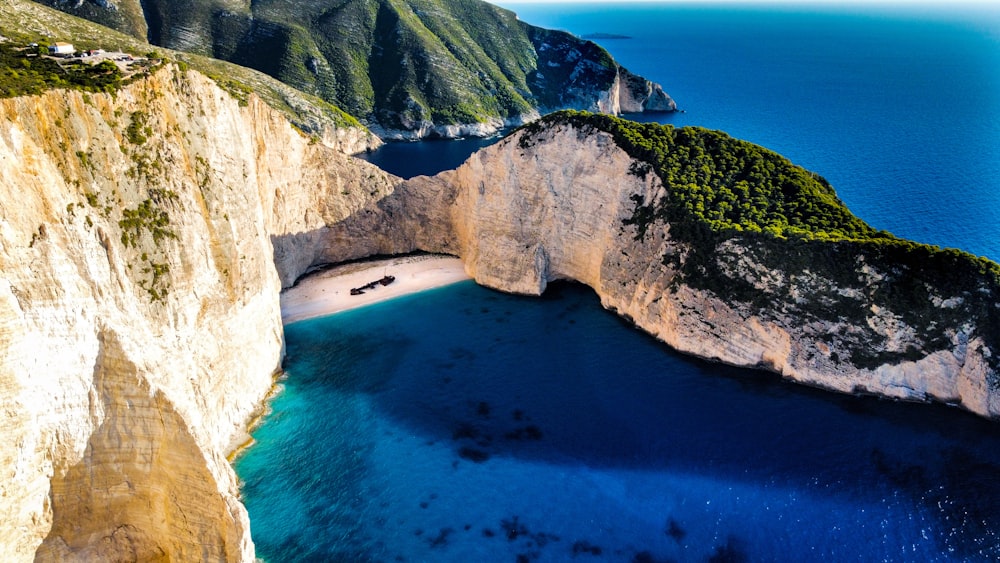 an aerial view of a beach and cliffs