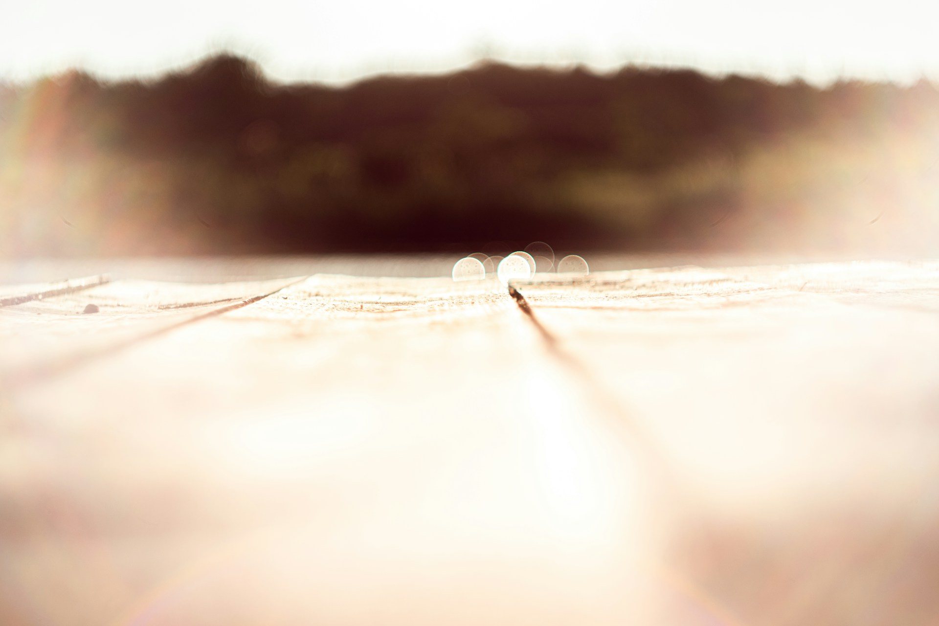woman wearing yellow long-sleeved dress under white clouds and blue sky during daytime