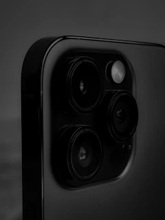 Close-up of a smartphone camera module with technical specs and user ratings overlay.