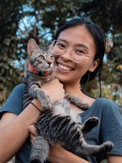 Guest holding a cat at CatWorld Samui