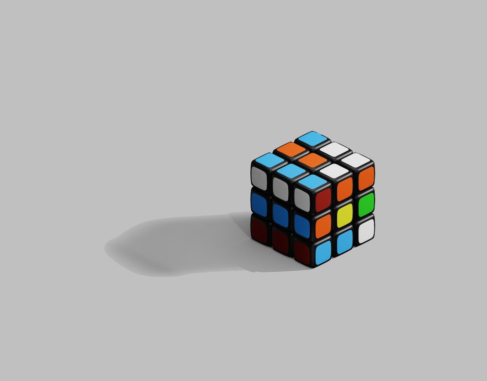 a rubik cube on a gray background