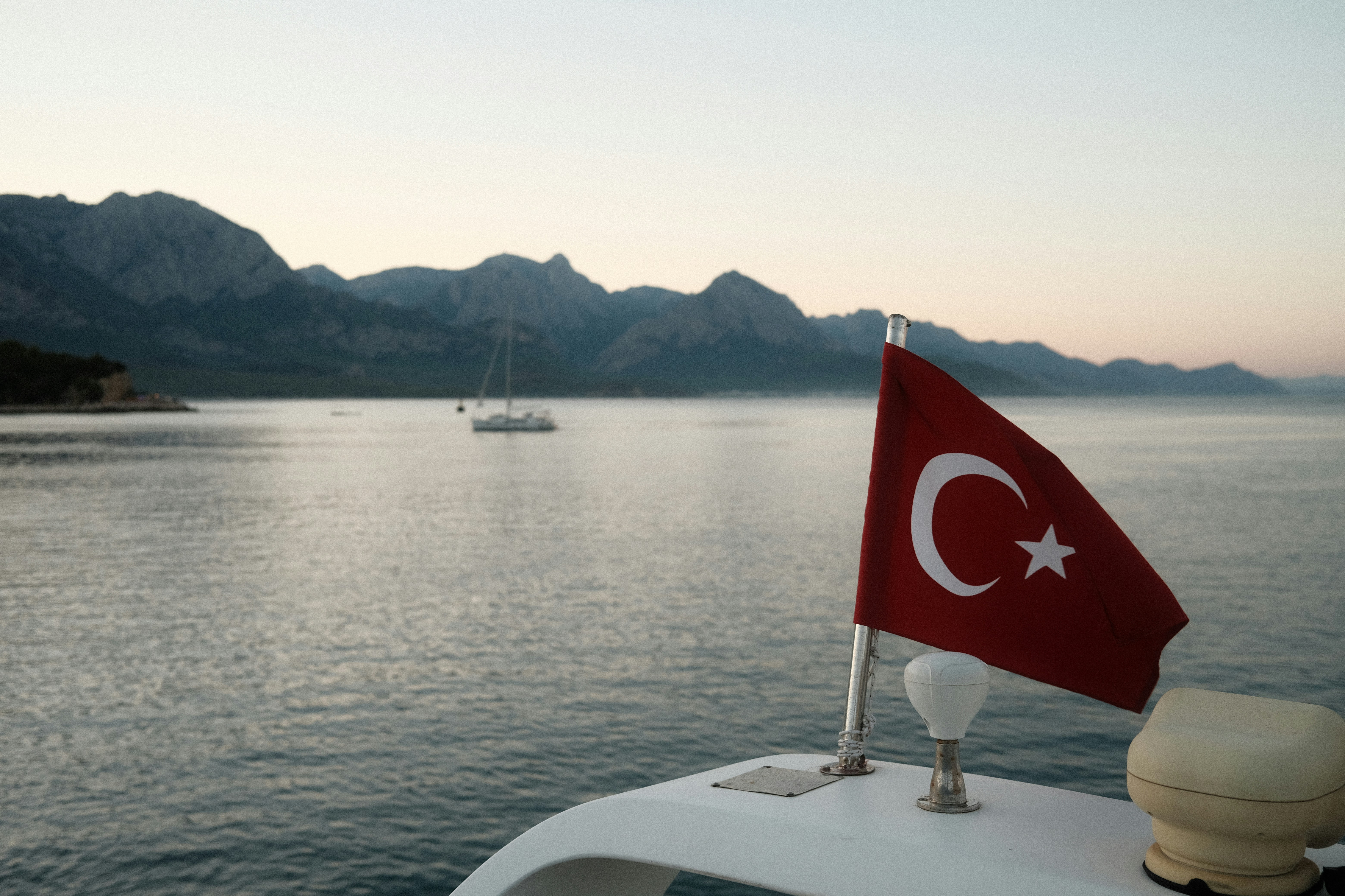 a flag on a boat in the water