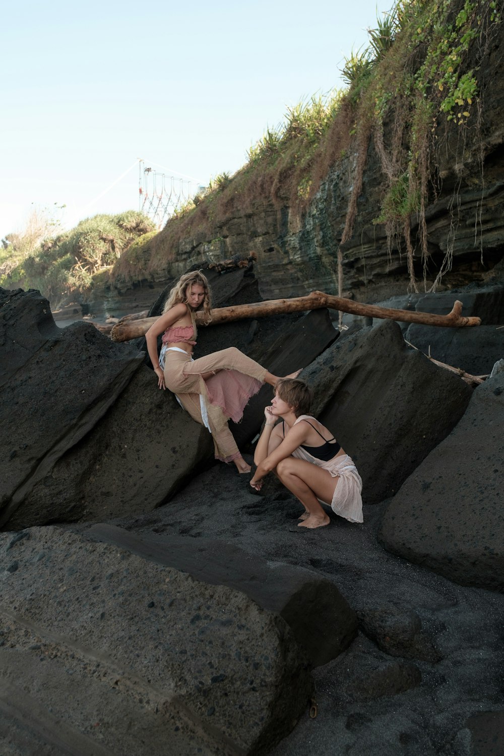 a couple of people that are sitting on some rocks