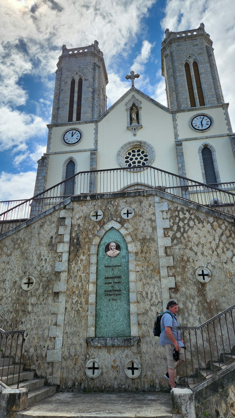 a man is standing in front of a church