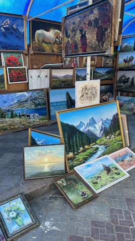 a bunch of paintings that are on the ground