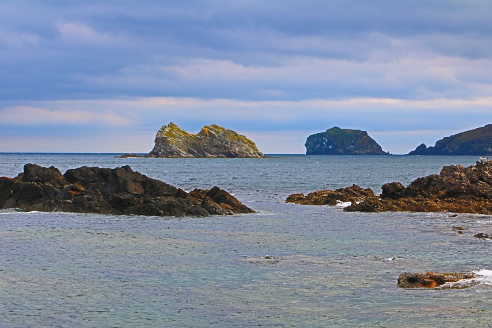 a large body of water surrounded by rocks