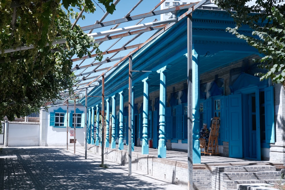 a blue building with blue doors and windows